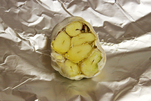 How to Roast Garlic: drizzle garlic head with olive oil