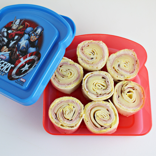 Malibu Chicken Tortilla Pinwheels -- a fun lunch idea that is a great alternative to traditional sandwiches. Inspired by the Malibu Chicken entree at Sizzler restaurants. 