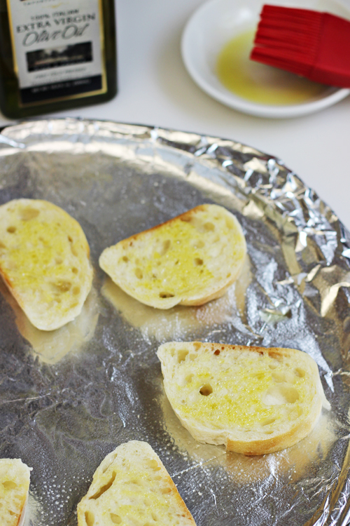 Brush bread with olive oil for Breakfast Crostini