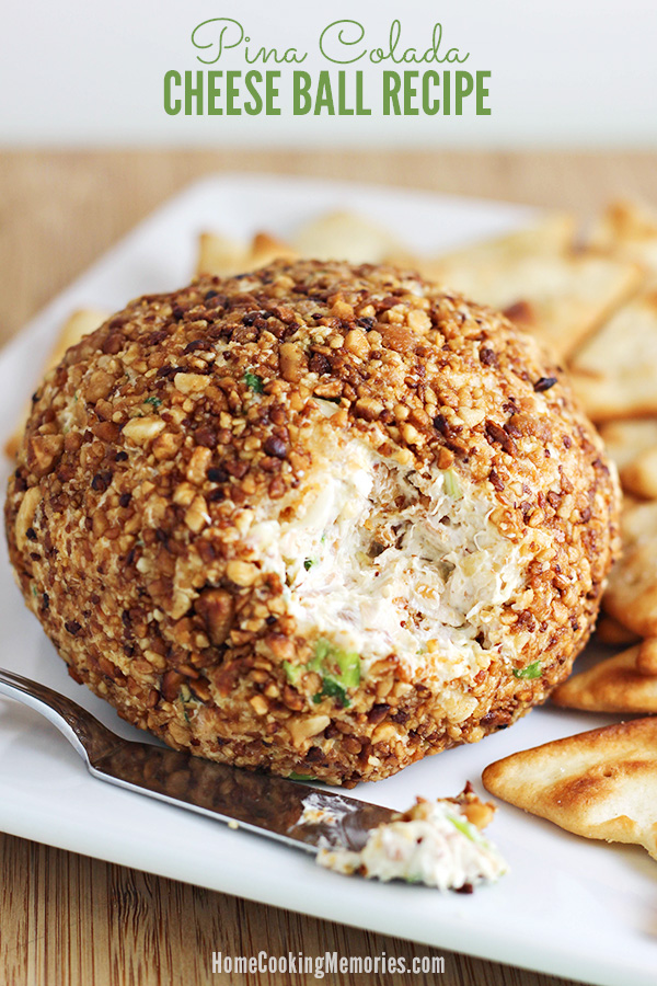 This Pina Colada Cheese Ball recipe is sure to be a favorite at your parties! Features the delicious flavors of macadamia nuts, cream cheese, pineapple, green onions, and coconut.