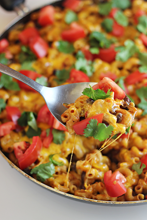One-Pan Cheesy Salsa Pasta - a Mexican-inspired dinner idea that you can make easily in 30 minutes or less -- and you'll have only one pan to clean up! 
