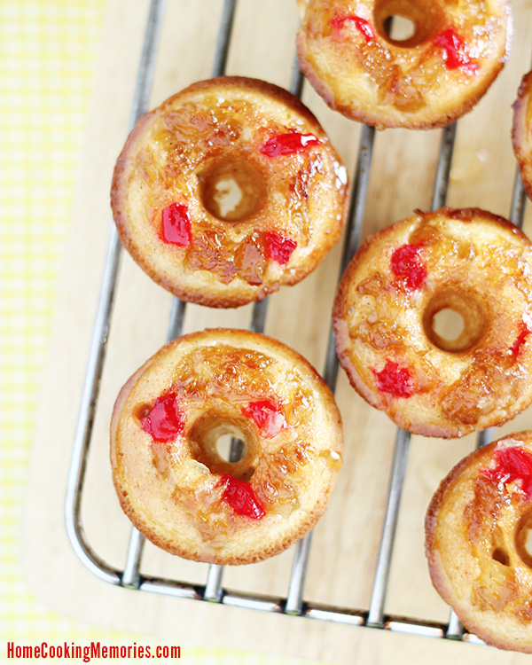 Mini Pineapple Upside Down Cake Doughnuts - baked donut recipe featuring golden pineapple, sweet maraschino cherries, and lots of inspiration from the nostalgic dessert we all love so much.