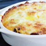 Easy Bacon Cheeseburger Casserole, baked in a white, oval casserole dish