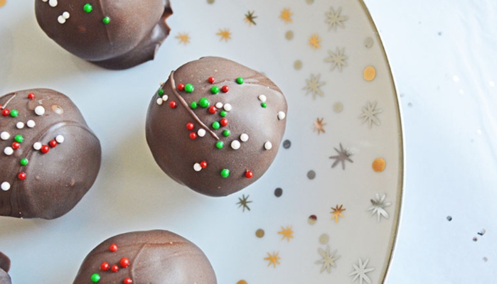 Christmas Peanut Butter Balls are a perfect treat to make to a holiday party this year!