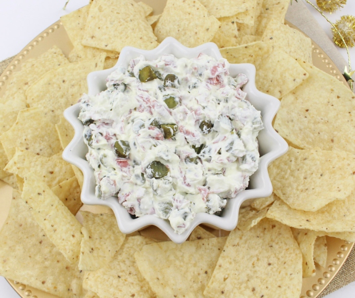 You can serve this Christmas Pickle Dip with tortilla chips, Triscuits, or pita crackers!