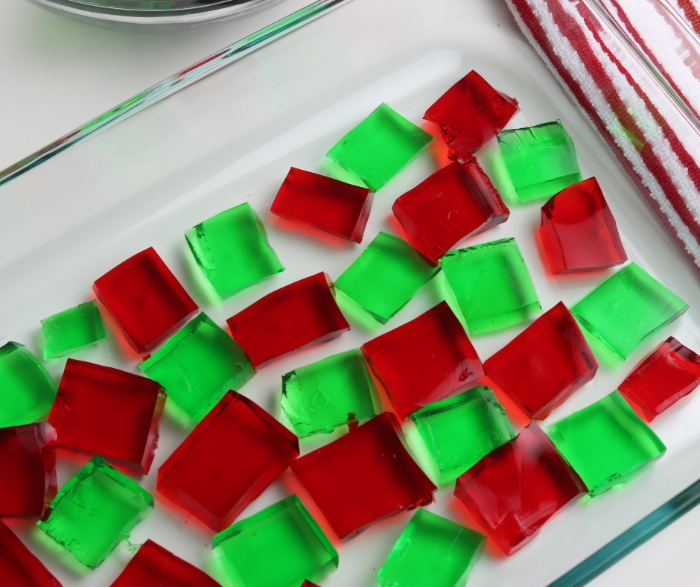 Add the cherry and lime gelatin squares to your prepared 13x9 pan.