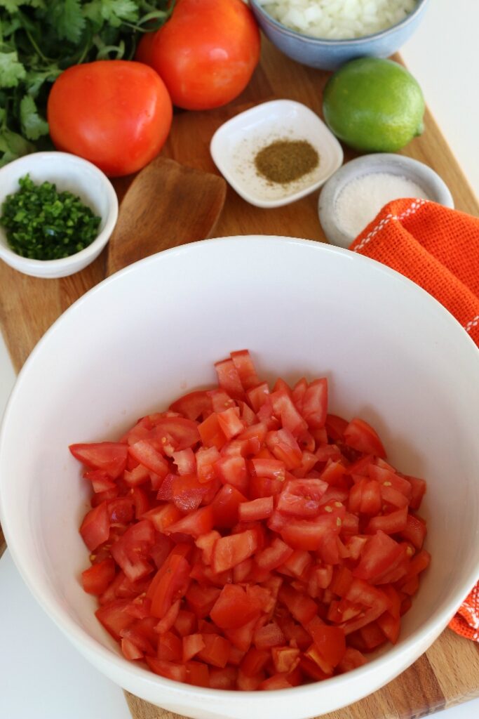 Chop up tomatoes to add to your Pico de Gallo!